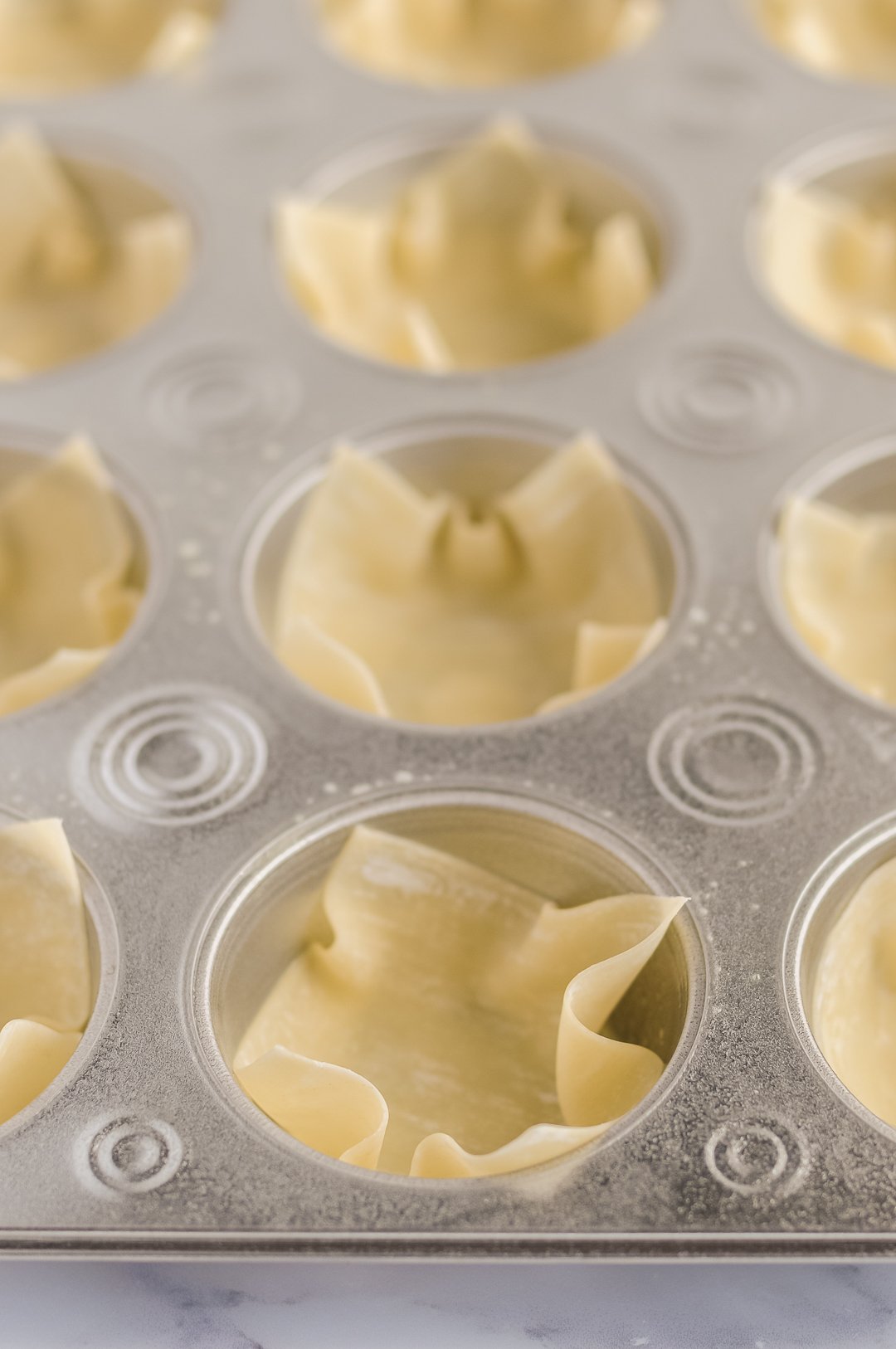 Putting apple pie into wonton cups