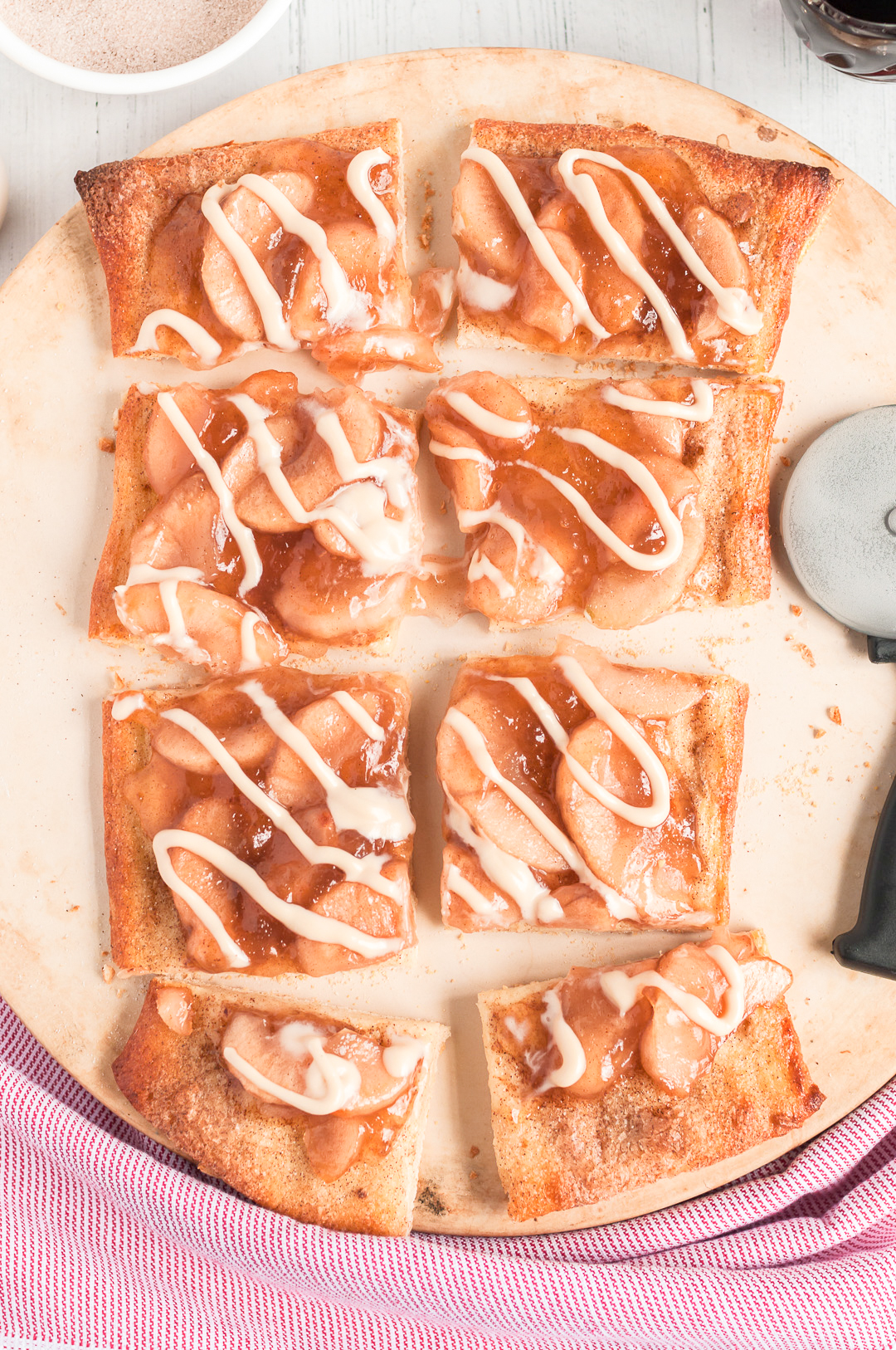 sliced apple pizza with icing