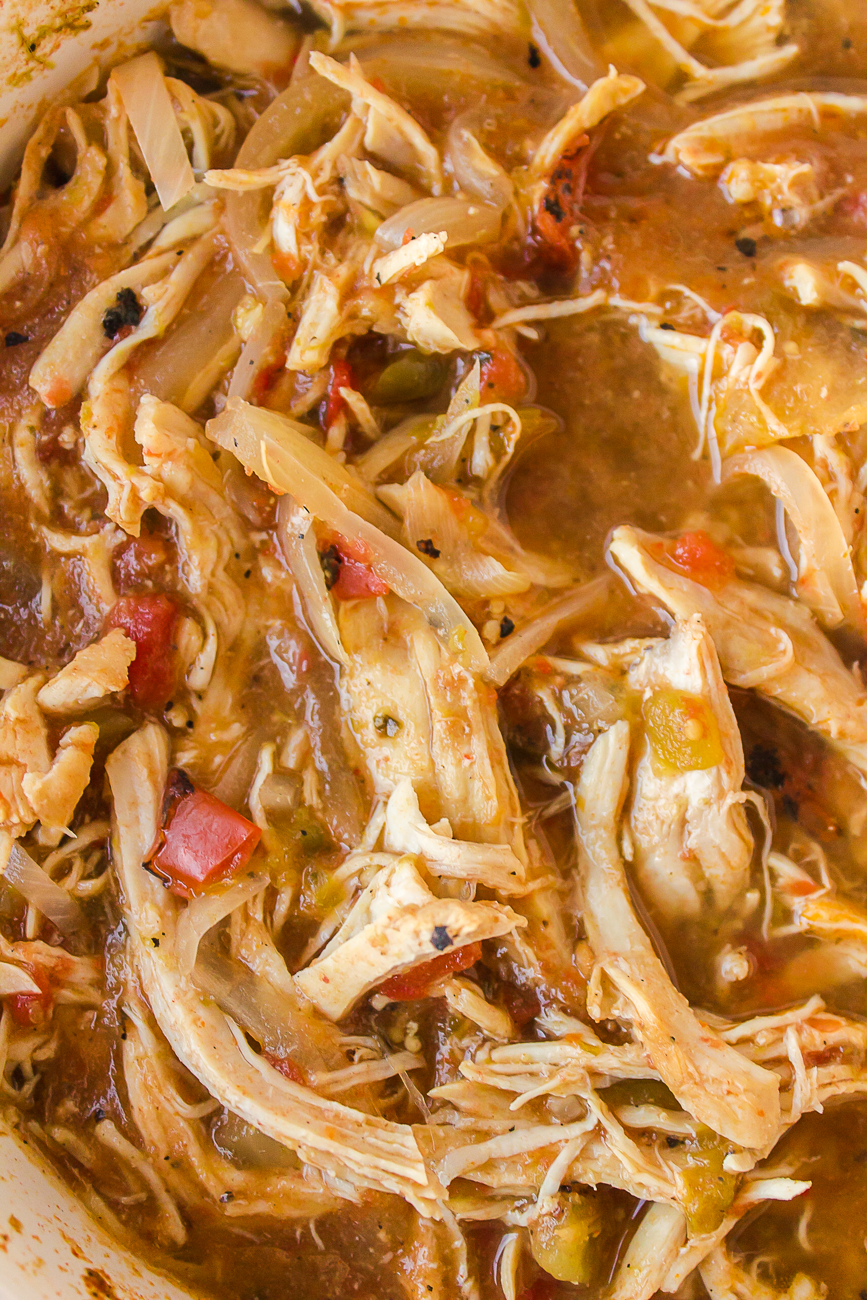 up close view of salsa verde chicken that is shredded