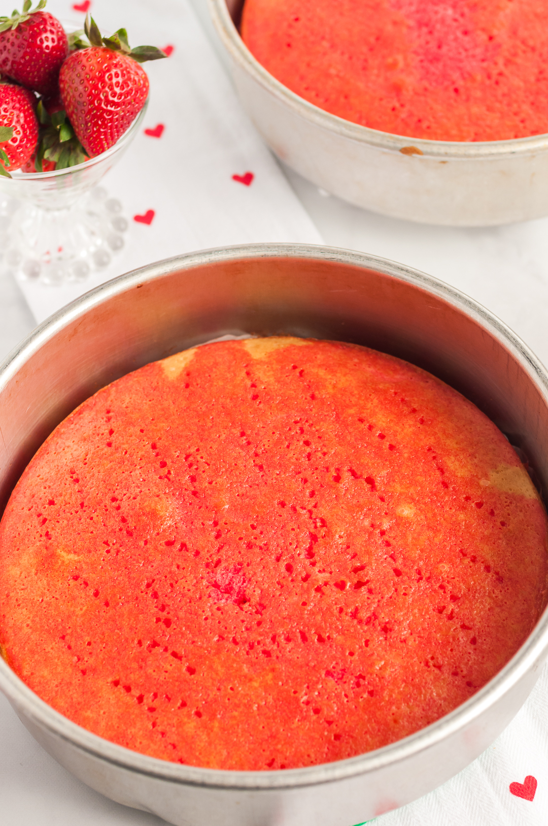 adding jello mix to cake for poke cake