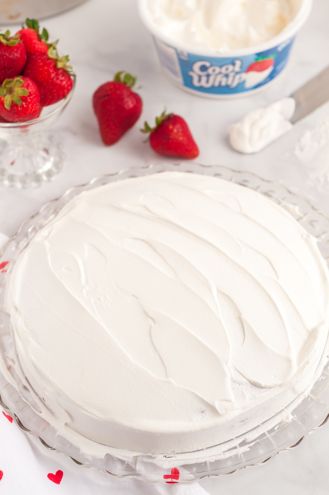 Cool Whip spread onto cake