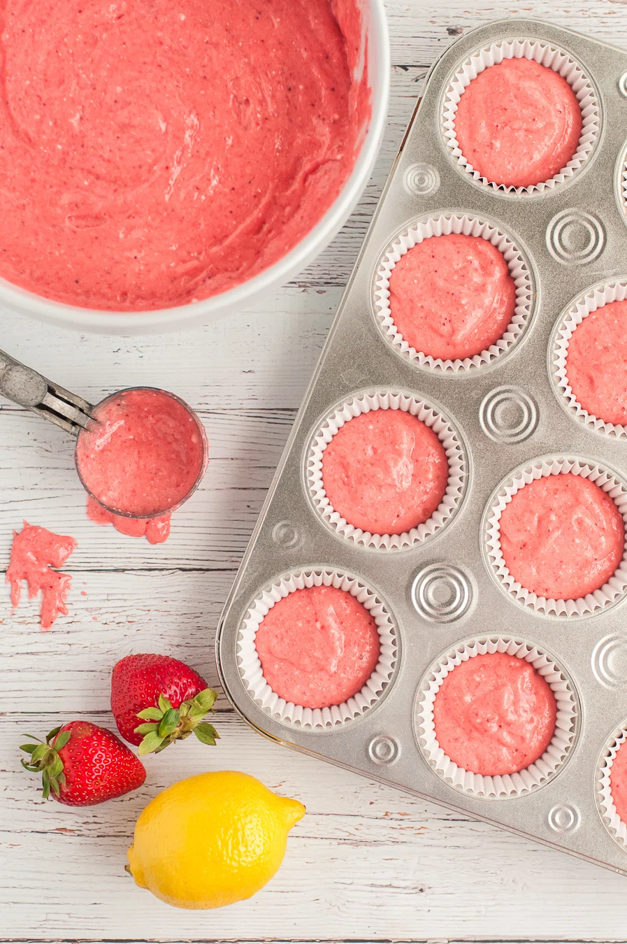 strawberry lemonade cupcakes batter scooped into cupcake tin