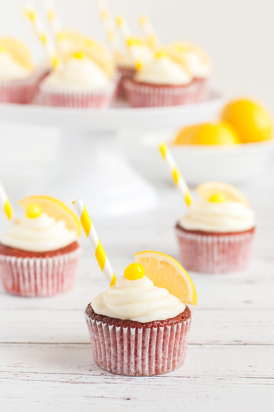 lemonade cupcakes on display with cake stand