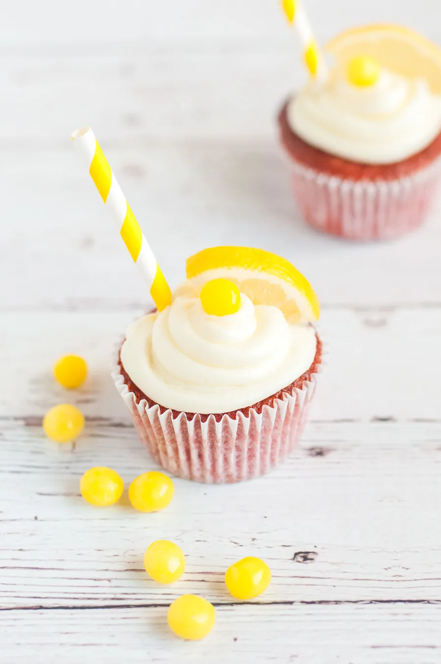 cute lemonade cupcakes with candy garnish and straws
