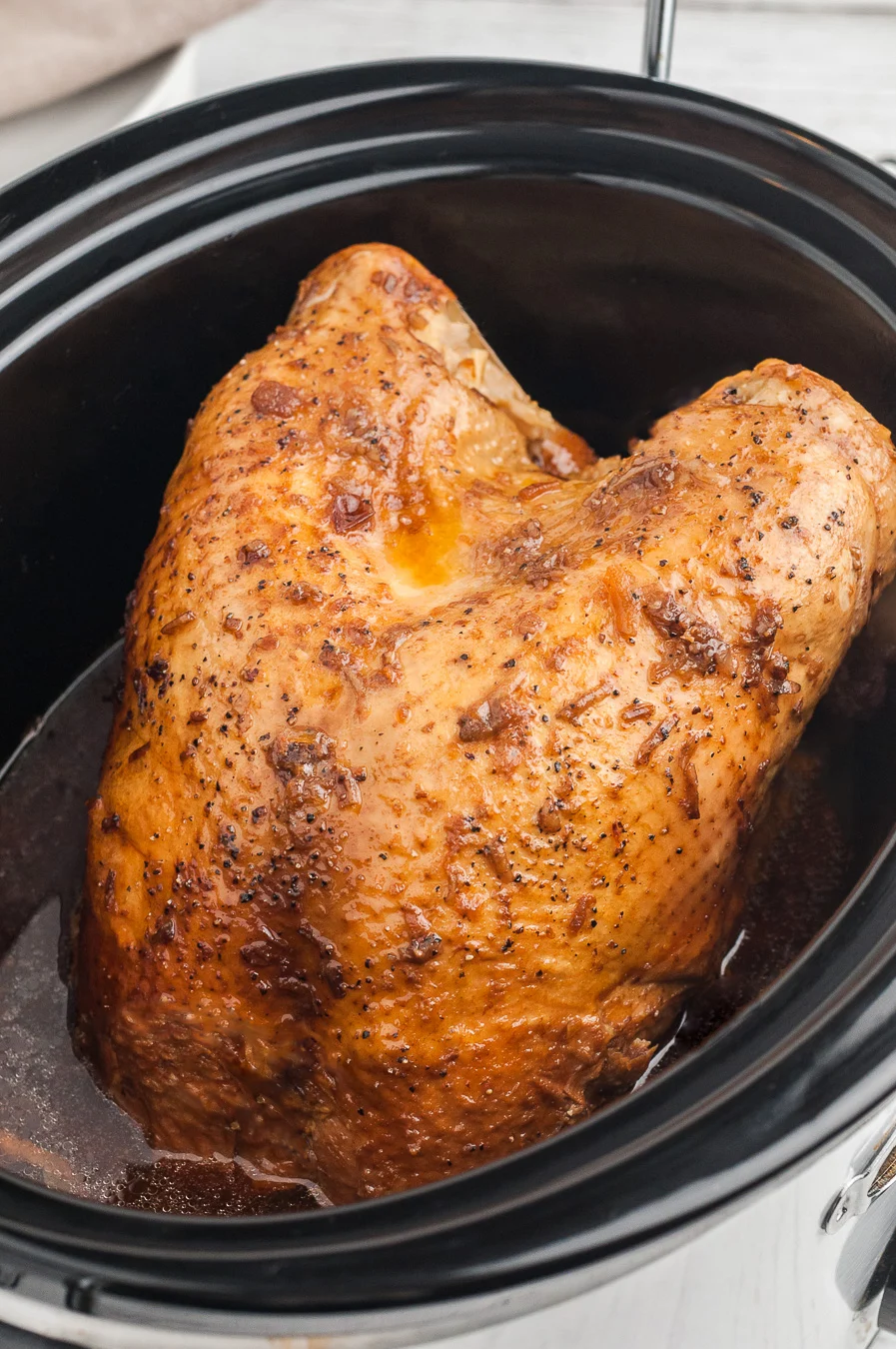 small turkey inside of a slow cooker