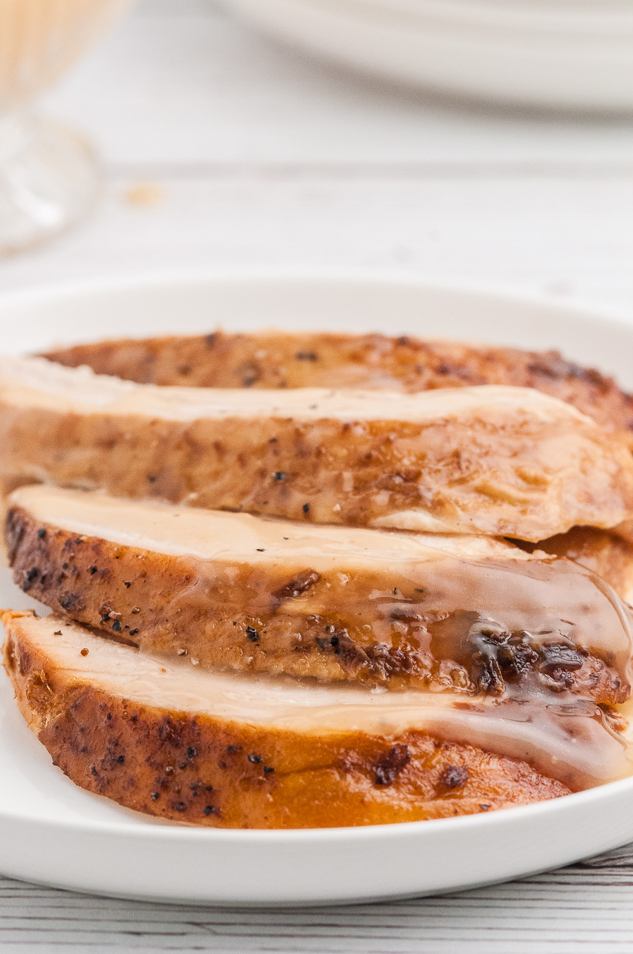 slices of turkey stacked on a plate