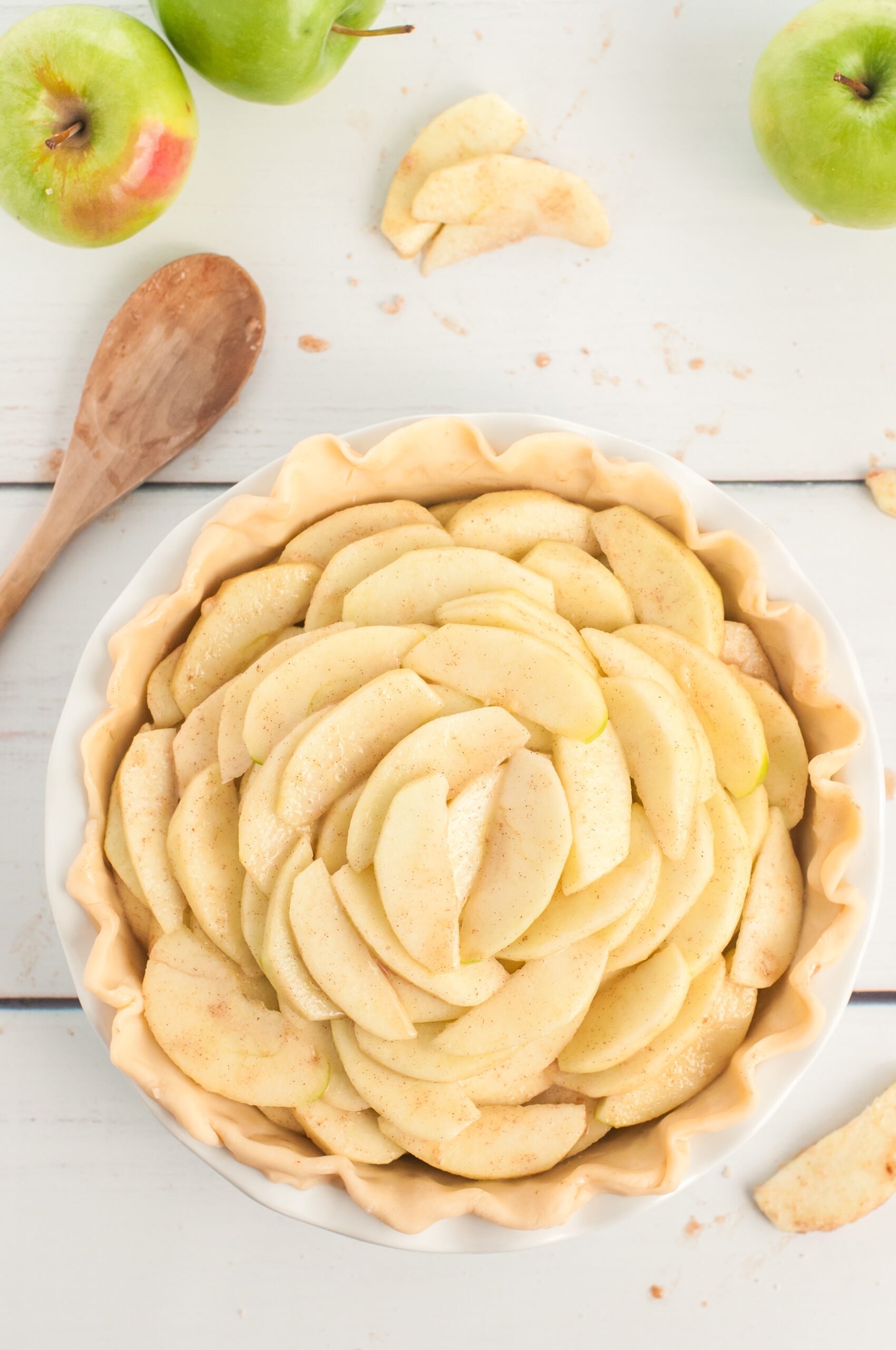 apples mounded inside pie dish