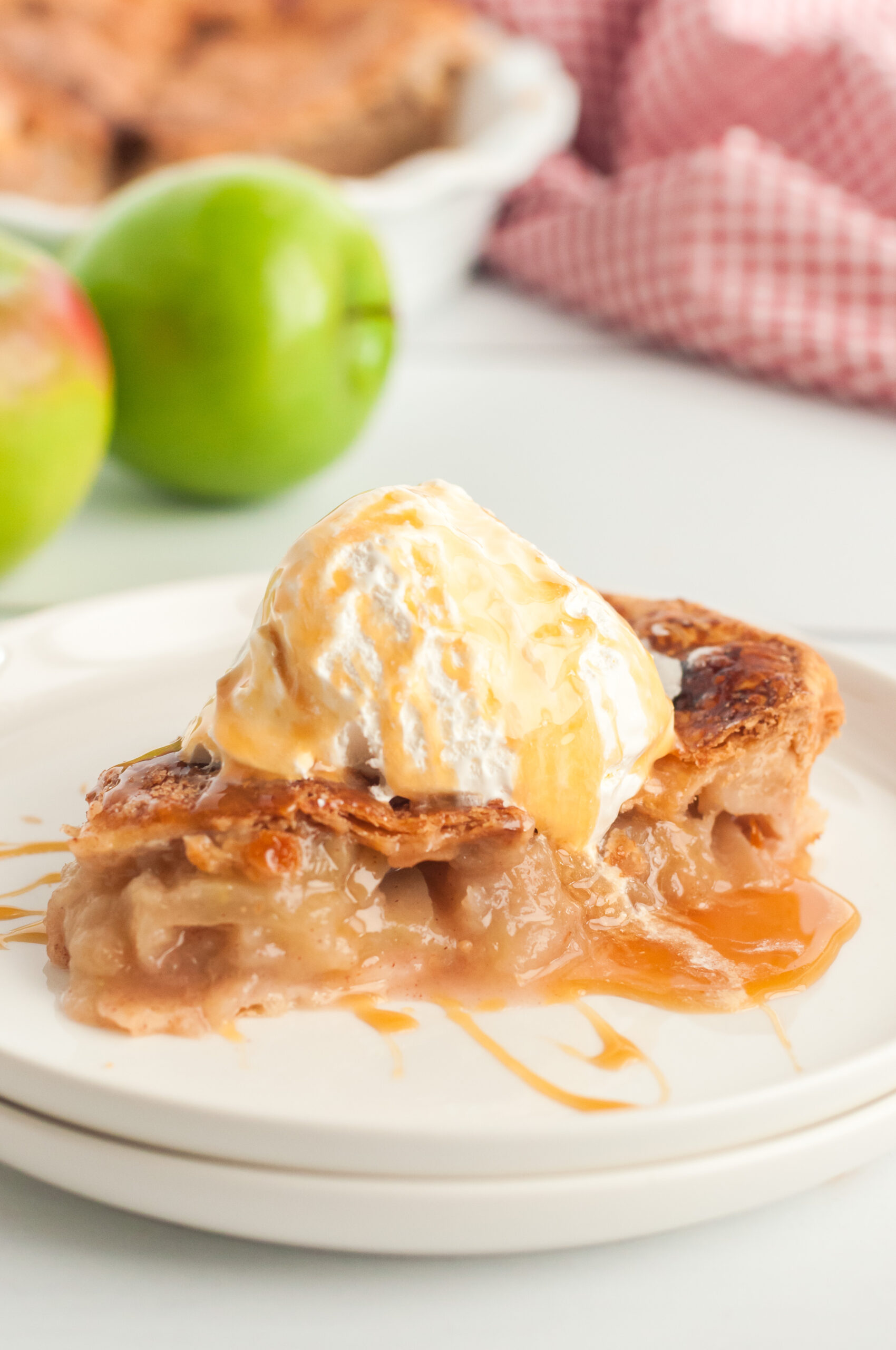 gorgeous slice of apple pie topped with vanilla ice cream