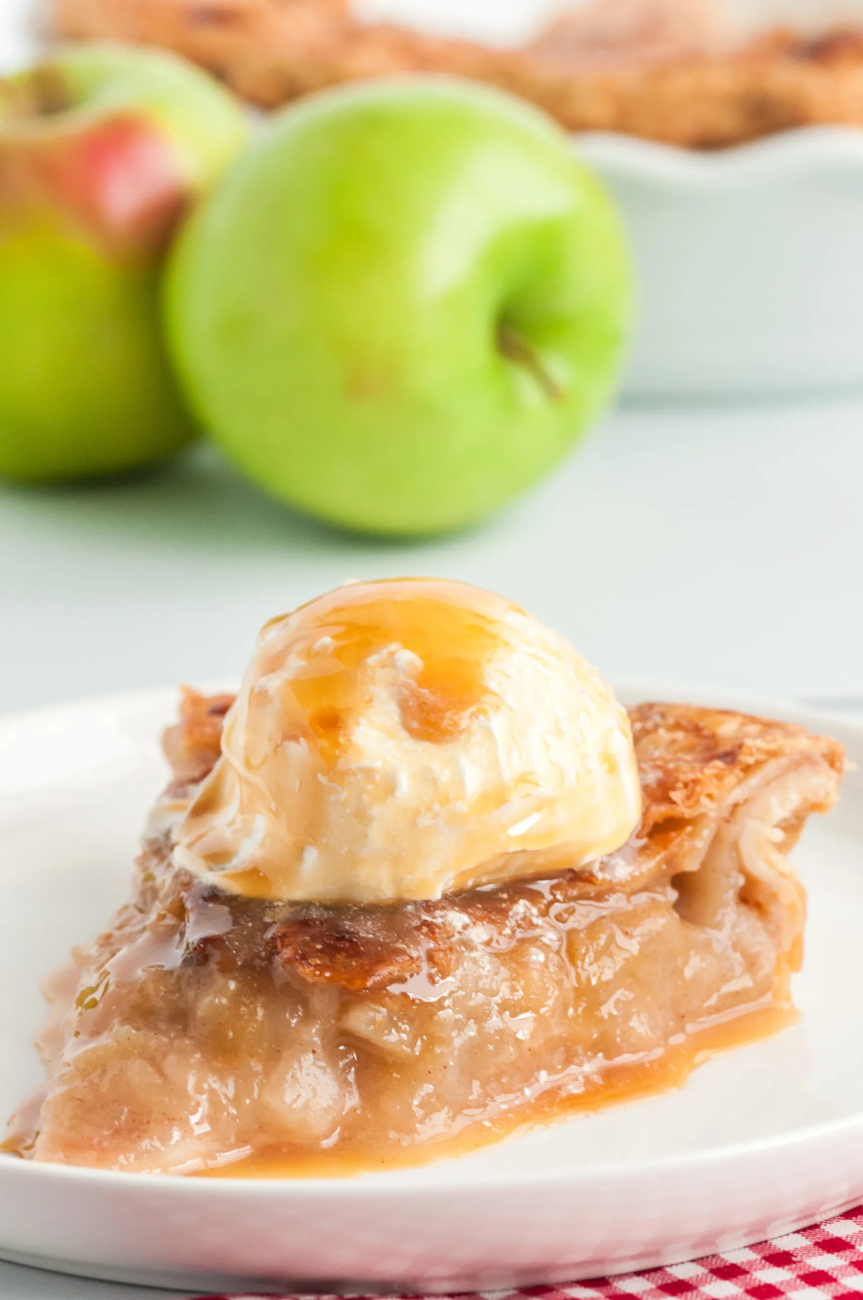 mouthwatering apple pie with caramel drizzled all over it.