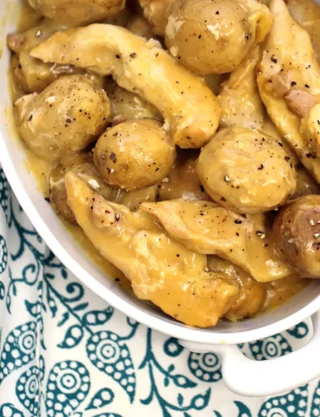 creamy chicken and potatoes in a serving dish