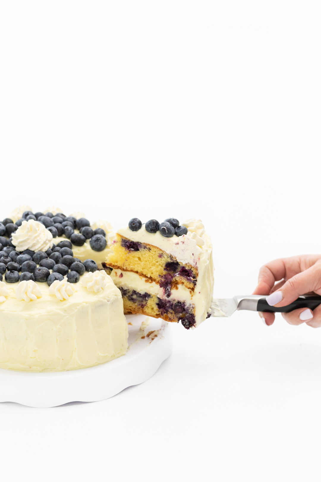 Cutting a slice of cake to serve.