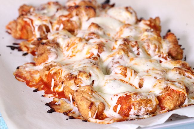 Ooey gooey popcorn chicken made with game day in mind. Buffalo Sauce, Creamy Blue Cheese and Mozz Cheese make this irresistible !