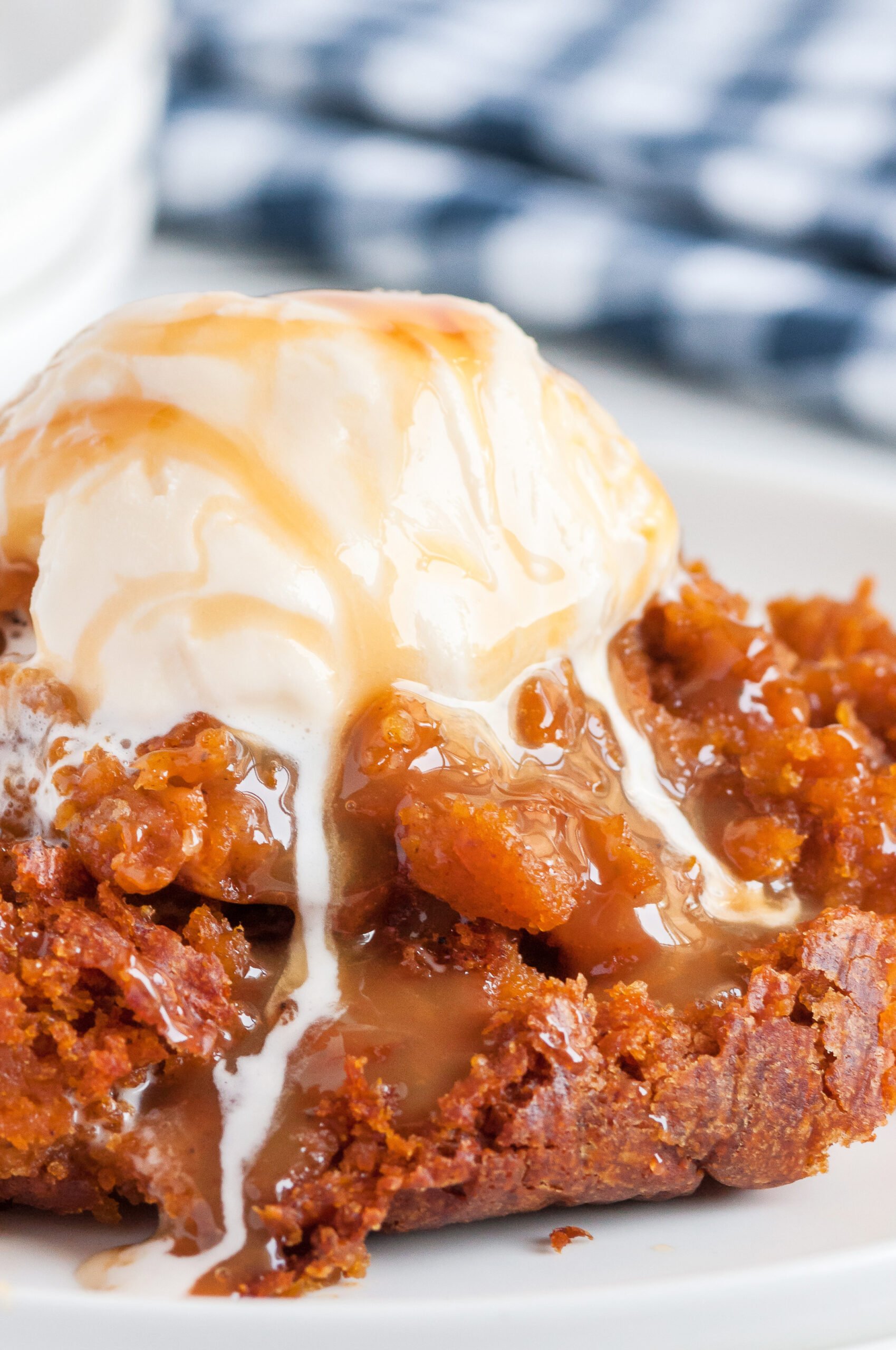 pumpkin cake served on a plate with melted ice cream and cake