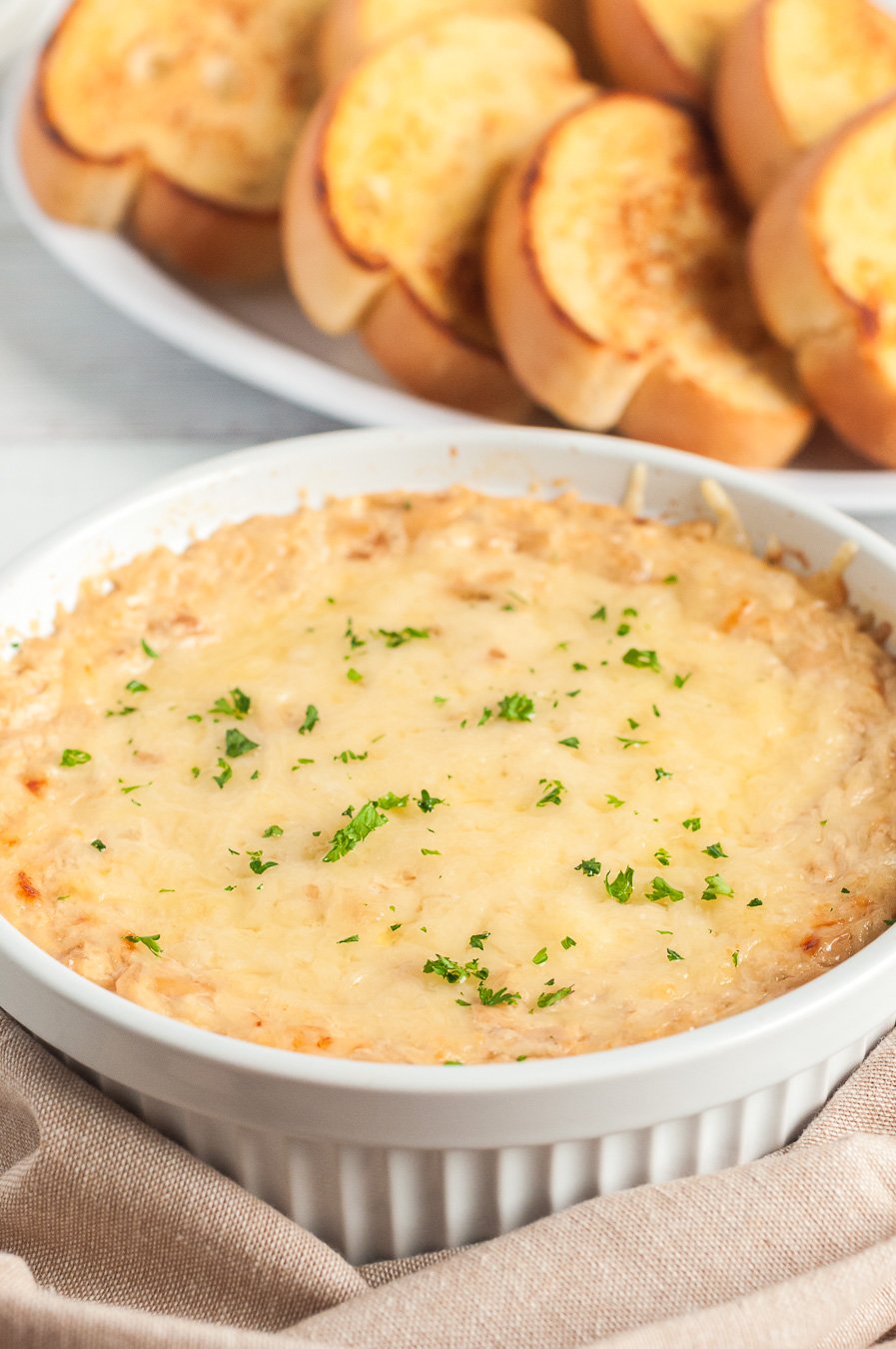 delicious dip baked with herbs sprinkled on top