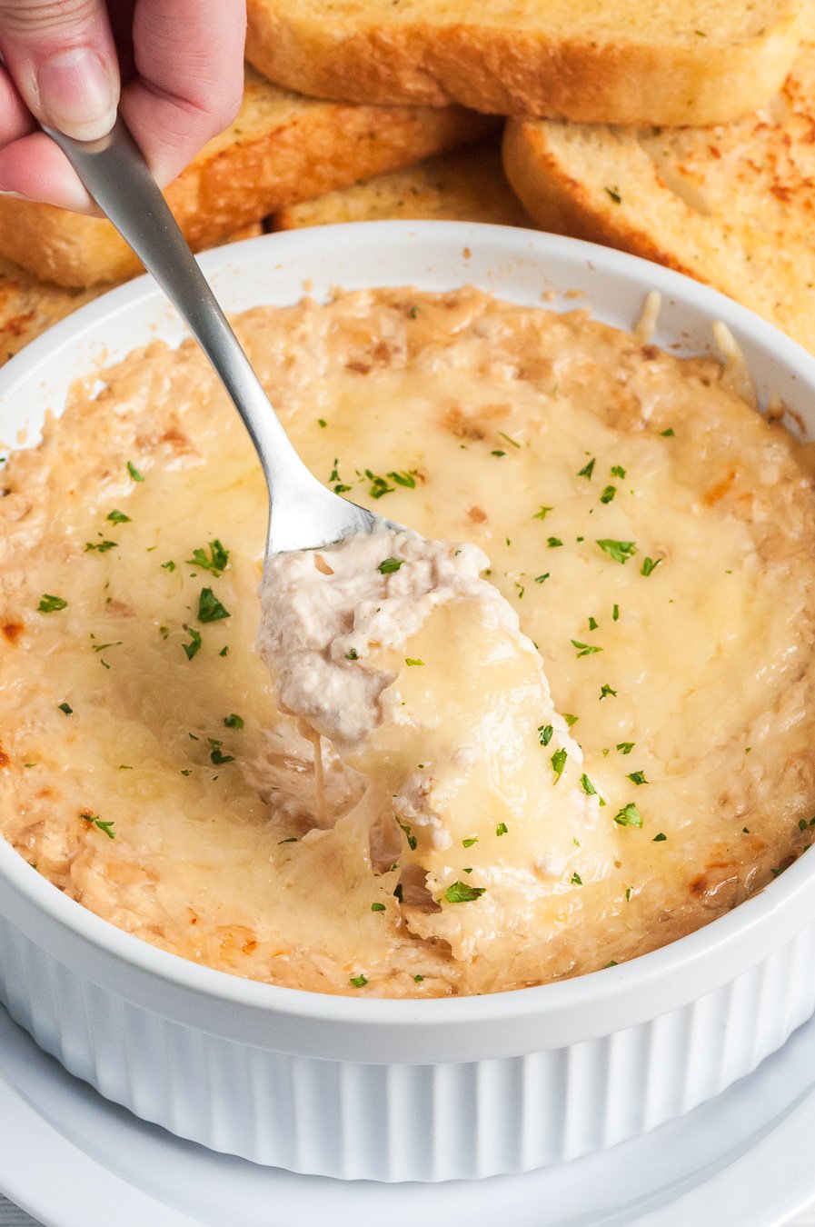 spooning dip out of serving bowl