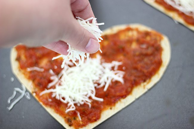 Make your sweetie smile with this super easy heart shaped pizza flatbread with the cutest heart shaped pepperoni. 