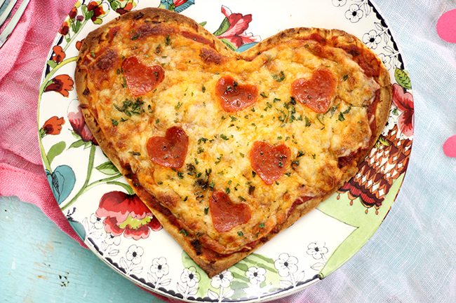 Make your sweetie smile with this super easy heart shaped pizza flatbread with the cutest heart shaped pepperoni. 