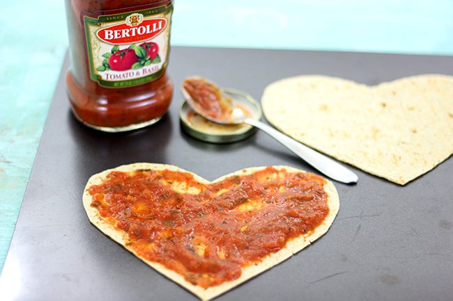 Make your sweetie smile with this super easy heart shaped pizza flatbread with the cutest heart shaped pepperoni. 