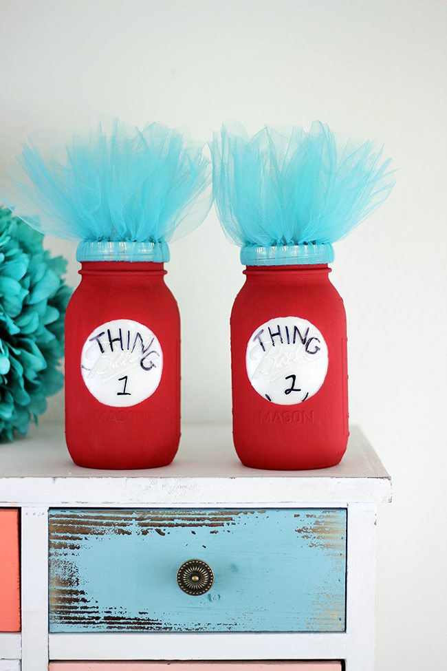 Dr. Seuss fan? Add a pop of fun to a room or party with these DIY Thing 1 and Thing 2 Mason Jars. So adorbs!