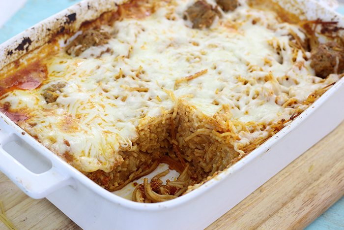 Get dinner in the oven fast with this comfort food. Spaghetti and Meatball casserole. As delish as it is simple!
