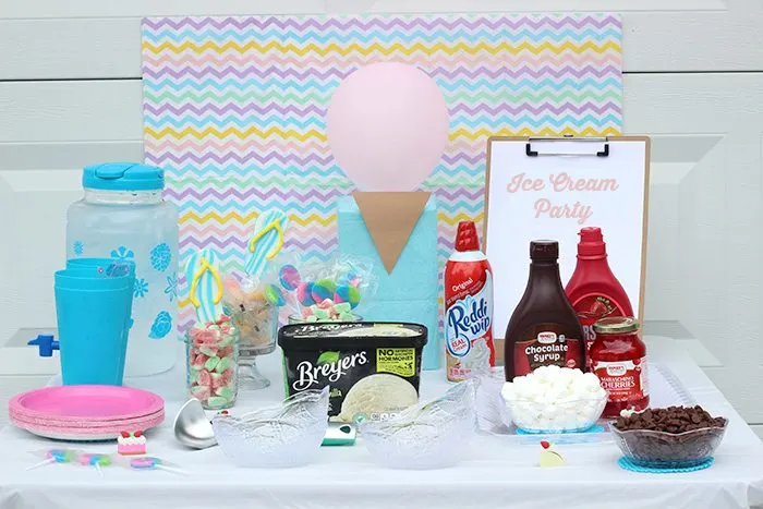 Cutest sweet ice cream party set up ideas. Get simple Dollar Store Budget Friendly Ideas to Make Your Party Pop. DIY Party. The tissue paper back drop is genius. 