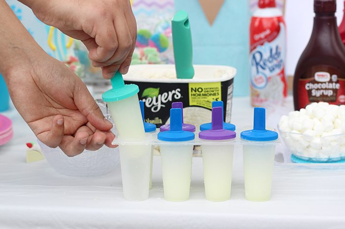 Cutest sweet ice cream party set up ideas. Get simple Dollar Store Budget Friendly Ideas to Make Your Party Pop. DIY Party. The tissue paper back drop is genius. 