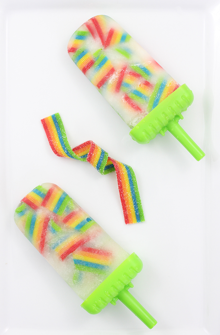 These taste SO good! So easy to make too. Just use Airheads Rainbow Candy for the cutest ice pop popsicles ever!