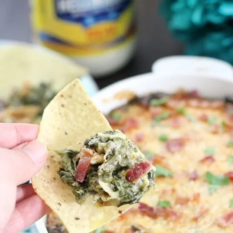 Creamy Spinach and Artichoke Dip with Parmesan Crust from your oven! Add bacon or sriracha for your own unique twist on this classic favorite.