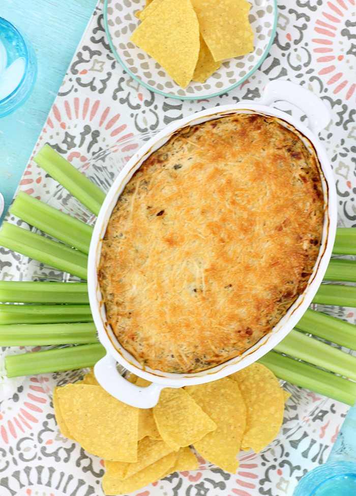 Hot broccoli dip made light with Greek Yogurt. Cheesy flavor packed goodness!