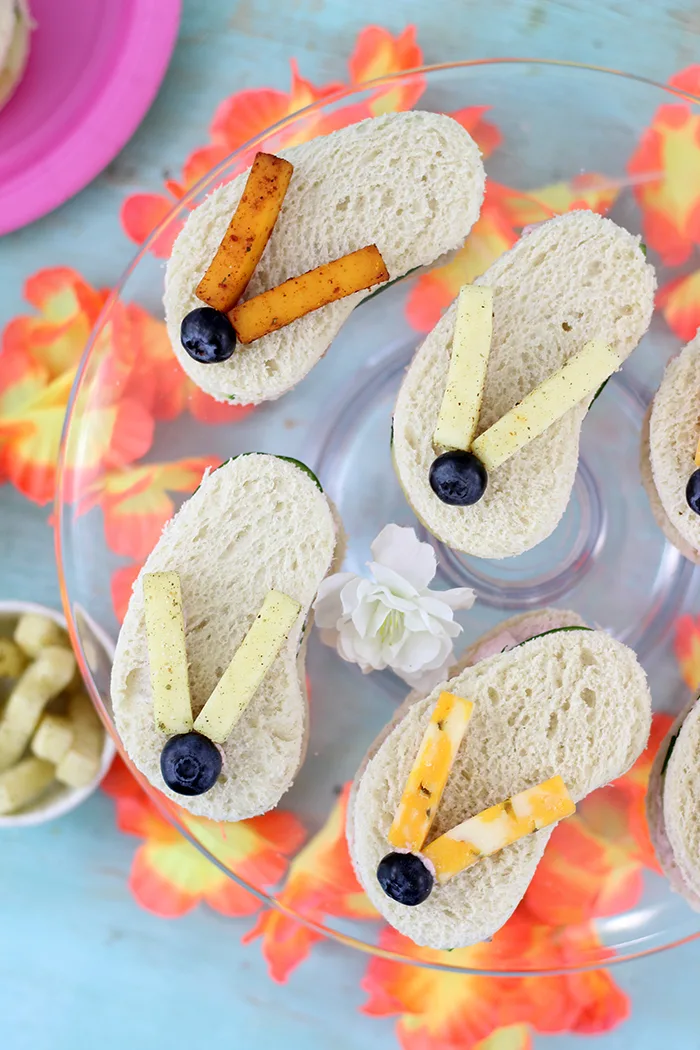 Flip Flop Sandwiches. So cute, great for summertime parties and beach parties. These are made with Sargento Cheese Snacks, Blueberries, Cucumbers and Strawberry Cream Cheese. Adorable! 