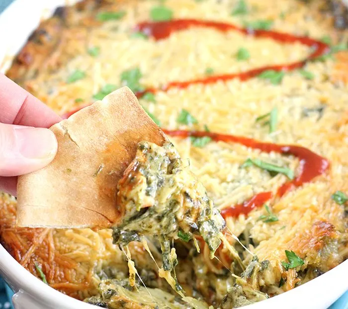 Creamy Spinach and Artichoke Dip with Parmesan Crust from your oven! Add bacon or sriracha for your own unique twist on this classic favorite. 