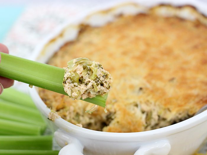 Hot broccoli dip made light with Greek Yogurt. Cheesy flavor packed goodness!