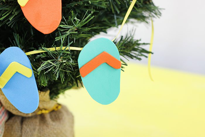 DIY Flip Flop Garland. Christmas in July? Make this fun craft that plays on a warm weather Christmas.