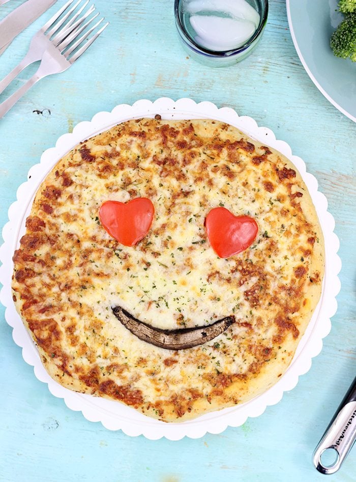 Smiley Face Veggie Pizza. Get your family smiling with these cute veggie emoticon pizza faces. From peppers. mushrooms, olives and broccoli you can get fun in the kitchen.