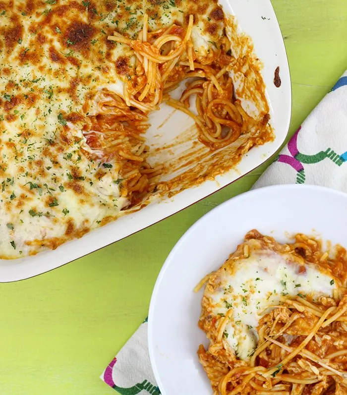 Cheesy Spaghetti Bake recipe comes together so quick and is SO cheesy and creamy. No joke. Perfect back to school recipe to add to your recipe box for sure.