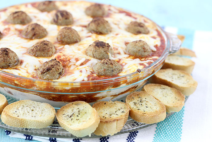 Layered Meatball Party Dip. Delicious oozy layers of cheese and meatballs. YUM.