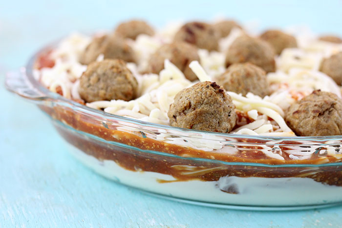 Layered Meatball Party Dip. Delicious oozy layers of cheese and meatballs. YUM.