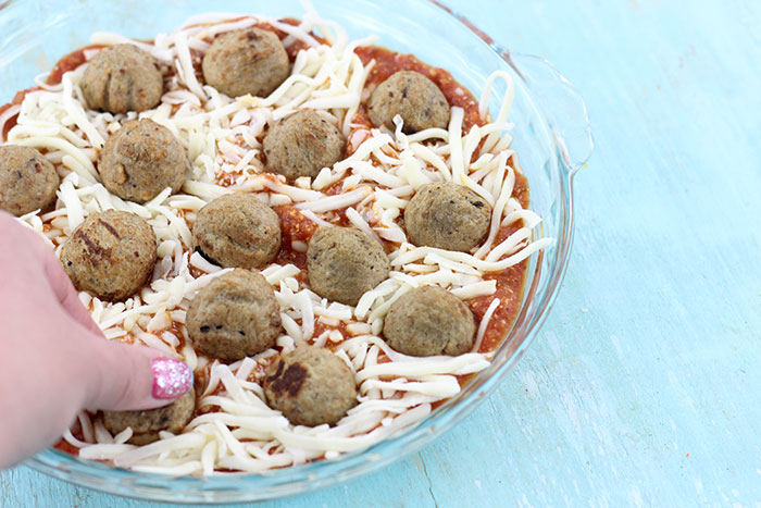 Layered Meatball Party Dip. Delicious oozy layers of cheese and meatballs. YUM.