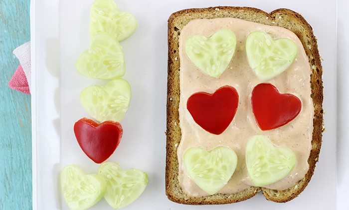 Veggie Valentine's Day Twist. Veggie Toasts with Cute Heart Shaped Veggies Served on Top.