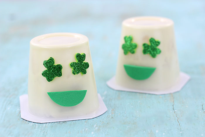 Shamrock Emoji Pudding Cups. Super cute craft idea to celebrate St. Patrick's Day.