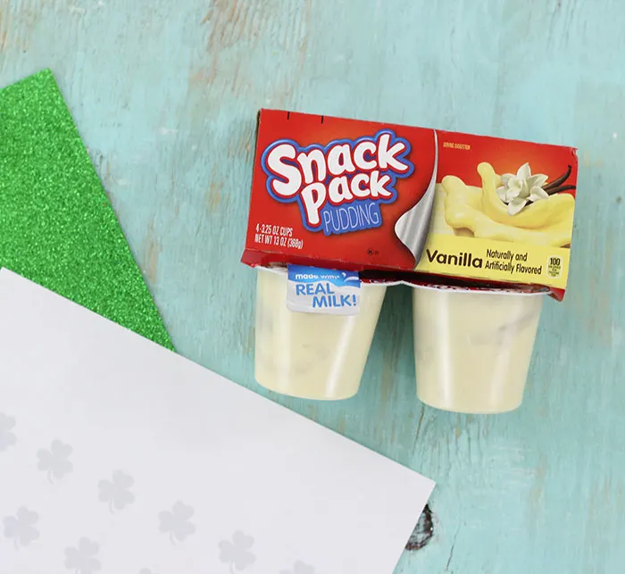 Shamrock Emoji Pudding Cups. Super cute craft idea to celebrate St. Patrick's Day.