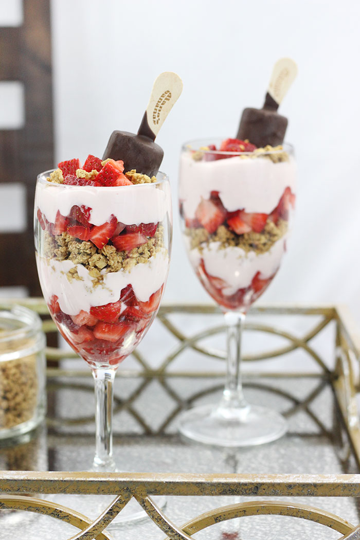 Best Breakfast Parfait! Strawberry, Bananas & Chocolate. Yummy layers of delicious strawberry yogurt, strawberries, granola and make it epic with a chocolate covered banana. Yum. 