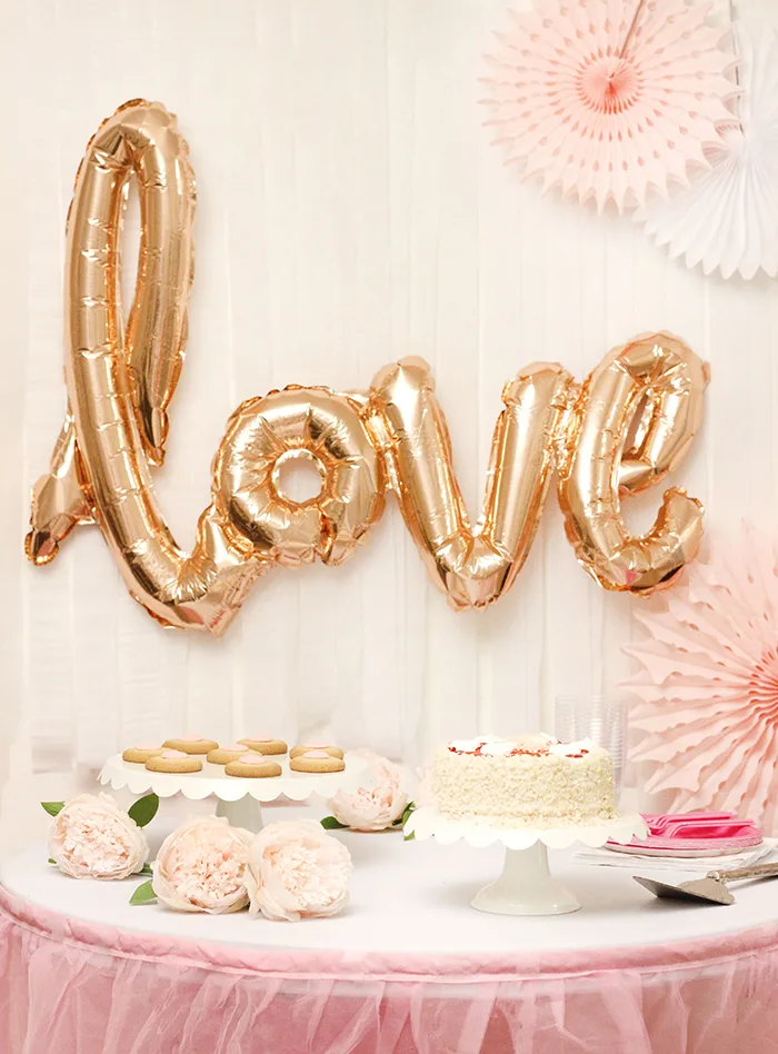 Mother's Day Party. Perfect Ice Cream Cake & Champagne and light pink decor. Pretty Mother's Day Party Ideas galore.