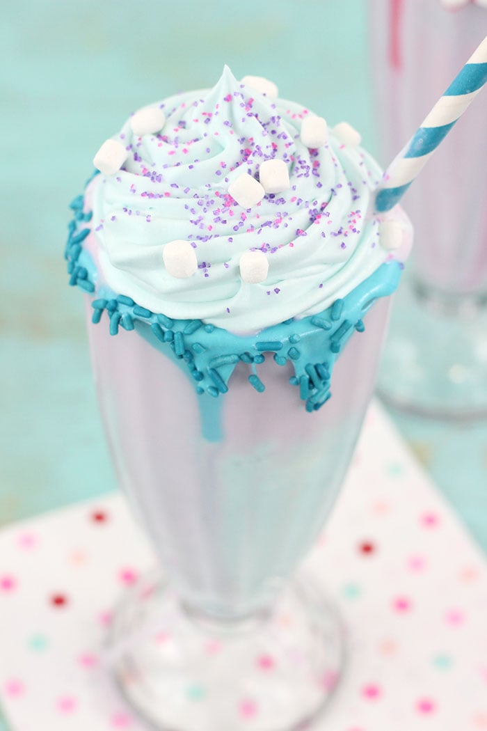 Unicorn Milkshakes are magical and oh so easy to whip up. Perfect for Unicorn themed parties and girl's night in. Unicorn ice cream is all the rage.
