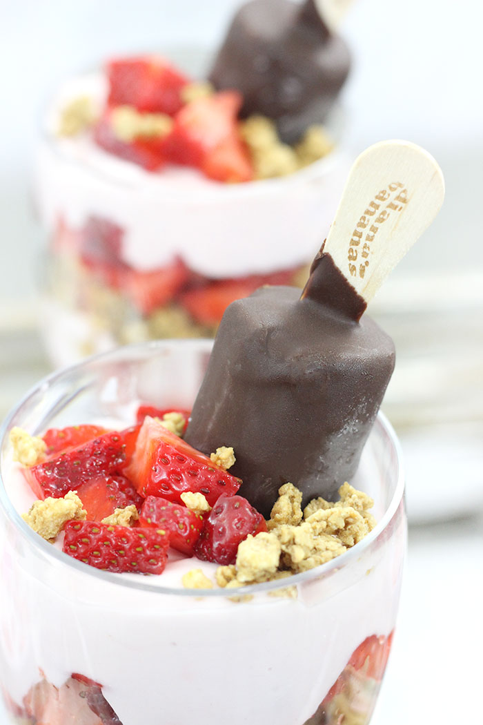 Best Breakfast Parfait! Strawberry, Bananas & Chocolate. Yummy layers of delicious strawberry yogurt, strawberries, granola and make it epic with a chocolate covered banana. Yum. 