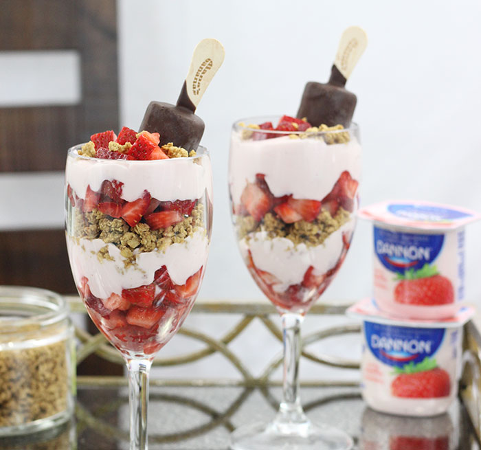 Best Breakfast Parfait! Strawberry, Bananas & Chocolate. Yummy layers of delicious strawberry yogurt, strawberries, granola and make it epic with a chocolate covered banana. Yum. 