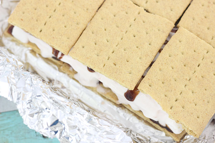 Strawberry S'mores Ice Cream Sandwiches. So easy and yummy. Customize your own ingredients.