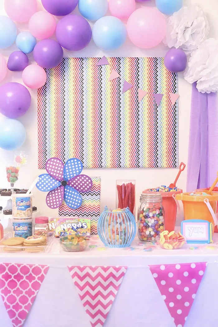 DIY Candy Buffet! Super easy and so fun. Use bright and whimsical colors to make it more magical. 