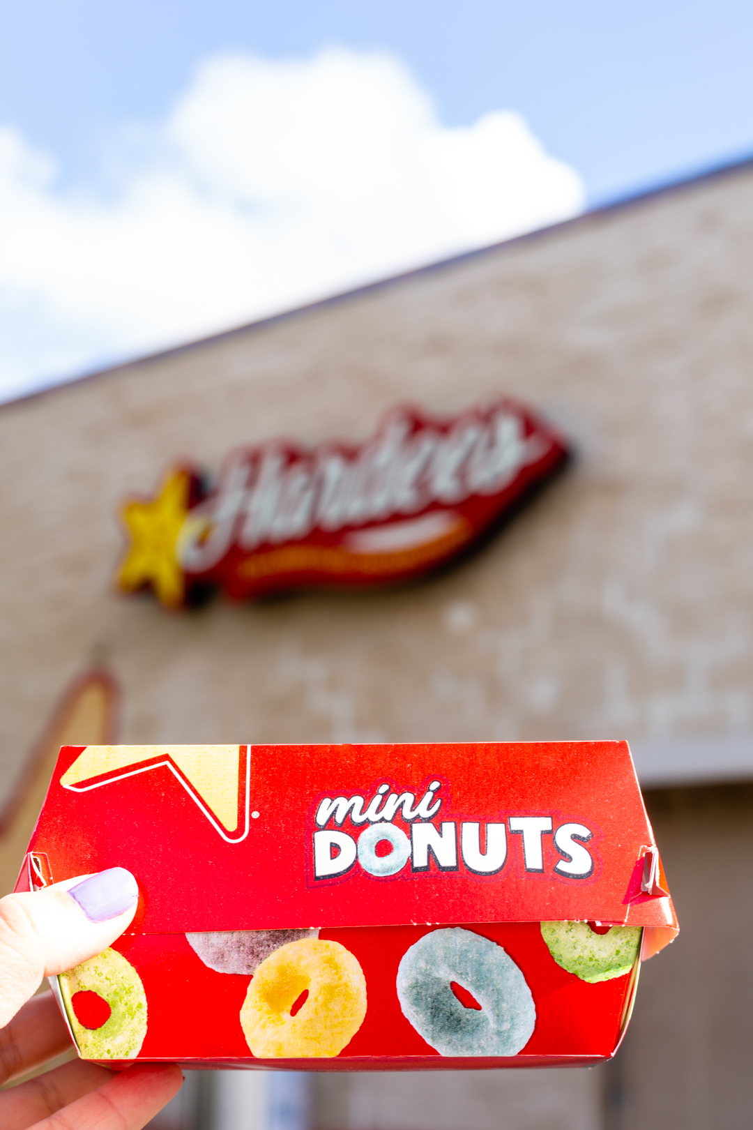 Froot Loop donuts exist and you need to get them at Hardees now before they are gone.