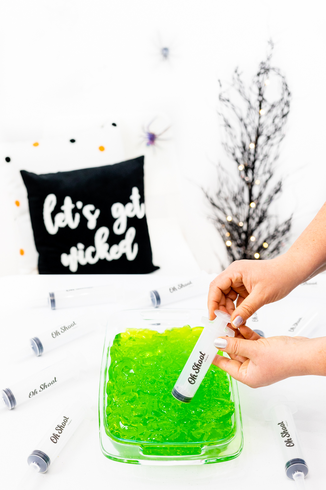 filling a syringe with green jello